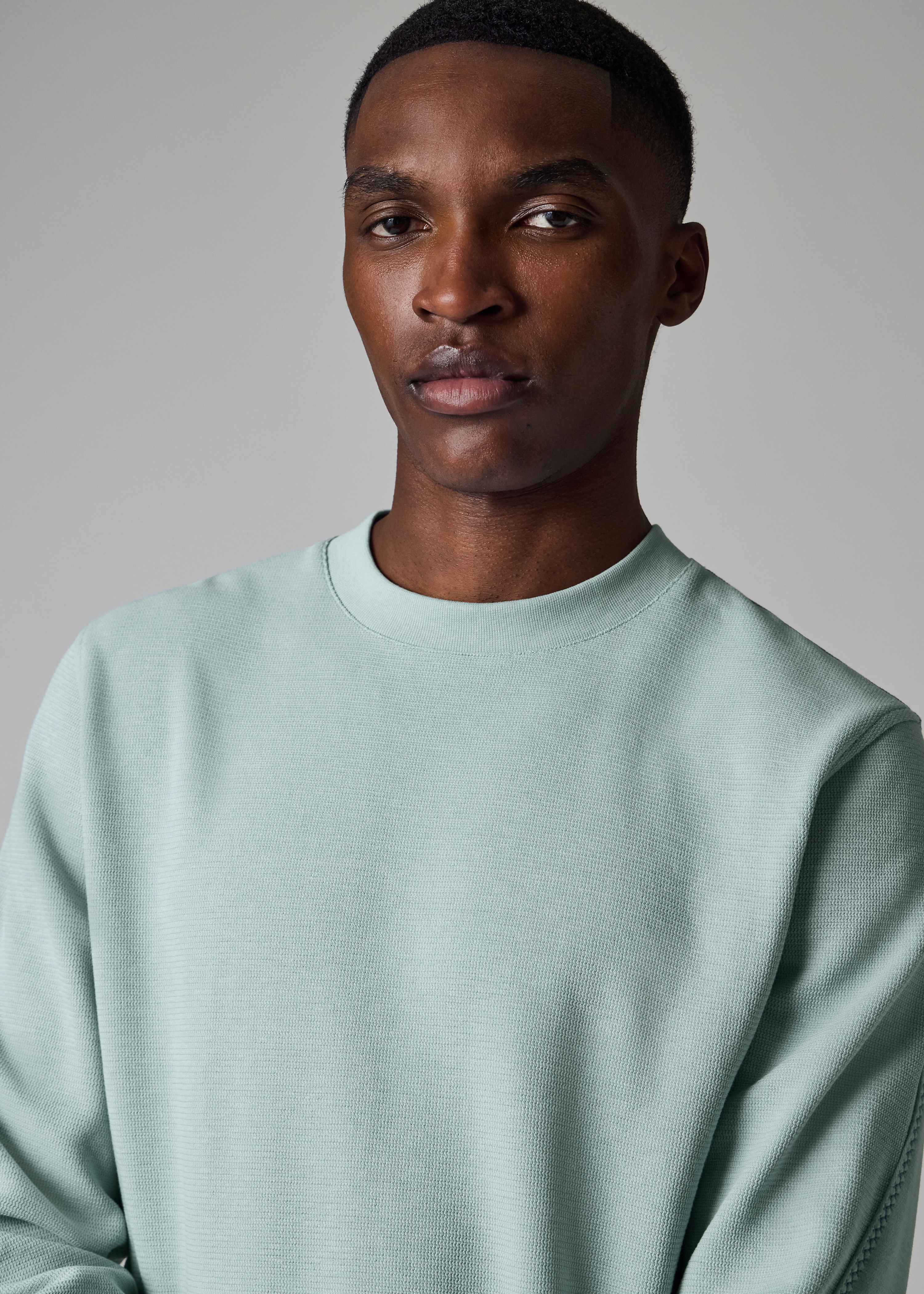 Light Blue Textured Sweatshirt with Contrast Embroidery